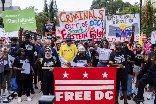 Protesters demonstrate against President Donald Trump’s planned use of federal law enforcement and National Guard troops in Washington, during a rally in front of the White House, Monday, Aug. 11, 2025, in Washington. (AP Photo/Julia Demaree Nikhinson)