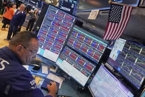 Specialist Anthony Matesic works at his post on the floor of the New York Stock Exchange, Wednesday, Aug. 13, 2025. (AP Photo/Richard Drew)