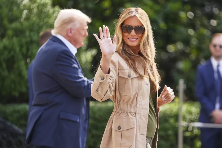 First lady Melania Trump waves as she and President Donald Trump depart the White House, Friday, July 11, 2025, in Washington. (AP Photo/Evan Vucci)