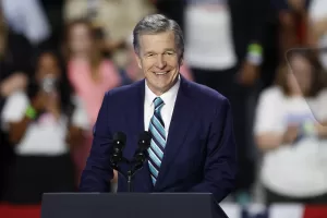 FILE – North Carolina Gov. Roy Cooper speaks at a campaign event in Charlotte, N.C., Sept. 12, 2024. (AP Photo/Nell Redmond, File)