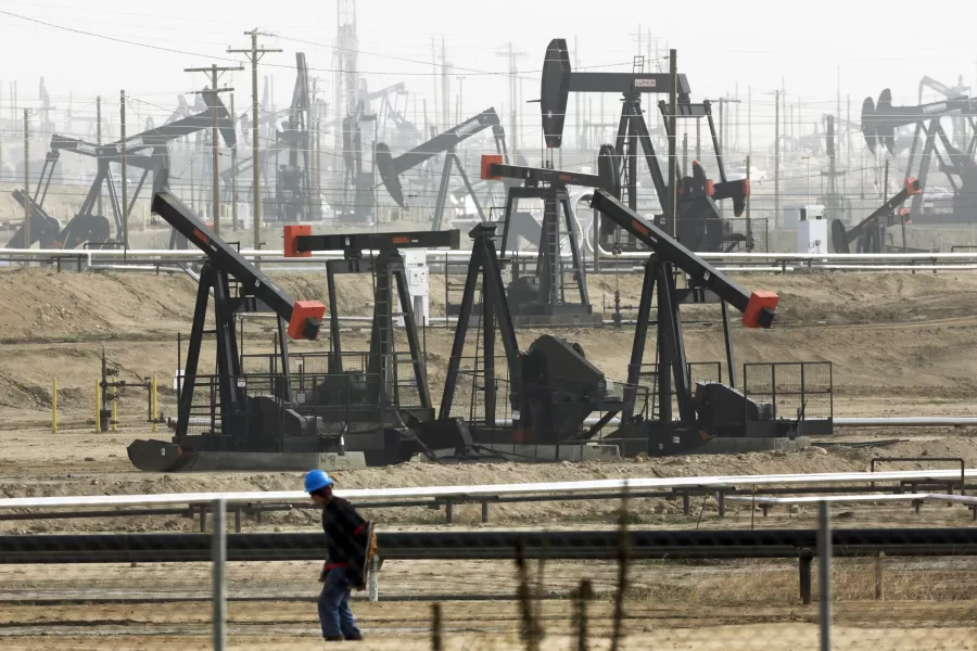 FILE – In this Jan. 16, 2015, file photo, pumpjacks are seen operating in Bakersfield, Calif. Last year, California Gov. Gavin Newsom called on the state Legislature to ban fracking by 2024. On Wednesday, Feb. 17, 2021, state Sen. Scott Wiener, a Democrat from San Francisco, introduced legislation that would ban the issuance or renewal of fracking permits starting on Jan. 1, 2022. The bill would also ban all fracking in California, along with other forms of oil extraction such as cyclic steaming, by Jan. 1, 2027. (AP Photo/Jae C. Hong, File)
