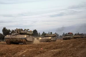Israeli soldiers move tanks at a staging area near the border with the Gaza Strip, southern Israel, Tuesday, Nov. 28, 2023. on the fifth day of a temporary cease-fire between Israel and Hamas. (AP Photo/Ohad Zwigenberg) Israeli soldiers move tanks at a staging area near the border with the Gaza Strip, southern Israel, Tuesday, Nov. 28, 2023. on the fifth day of a temporary cease-fire between Israel and Hamas. (AP Photo/Ohad Zwigenberg)