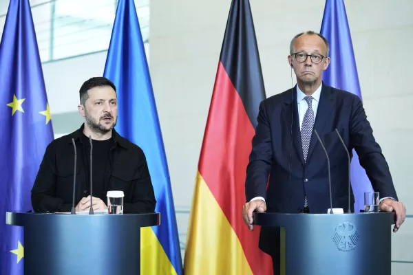 German Chancellor Friedrich Merz, right, and Ukrainian President Volodymyr Zelenskyy, left, attend a joint press statement following talks with European and U.S. leaders in Berlin, Germany, Wednesday, Aug. 13, 2025. (AP Photo/Ebrahim Noroozi)