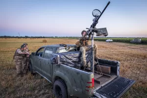 Ukrainian servicemen of the 15th Army Corps stand by an armed pickup truck during night duty in the Chernihiv region, Ukraine, late Tuesday, Aug. 12, 2025. (AP Photo/Dan Bashakov)