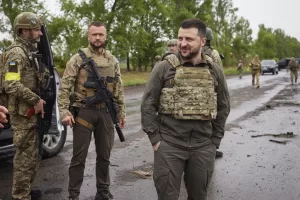 In this photo provided by the Ukrainian Presidential Press Office on Sunday, May 29, 2022, Ukrainian President Volodymyr Zelenskyy reacts as he visits the war-hit Kharkiv region. Volodymyr Zelenskyy described the situation in the east as "indescribably difficult." The "Russian army is trying to squeeze at least some result" by concentrating its attacks there, he said in a Saturday night video address. (Ukrainian Presidential Press Office via AP)