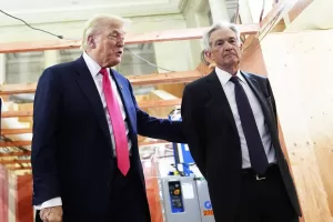 President Donald Trump, left, speaks with Federal Reserve Chairman Jerome Powell during a visit to the Federal Reserve, Thursday, July 24, 2025, in Washington. (AP Photo/Julia Demaree Nikhinson)