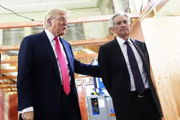 President Donald Trump, left, speaks with Federal Reserve Chairman Jerome Powell during a visit to the Federal Reserve, Thursday, July 24, 2025, in Washington. (AP Photo/Julia Demaree Nikhinson)