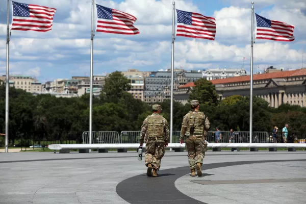 National Guardsmen patrol at the base of the Washington Monument, Monday, Aug. 25, 2025, in Washington. (AP Photo/Rahmat Gul)