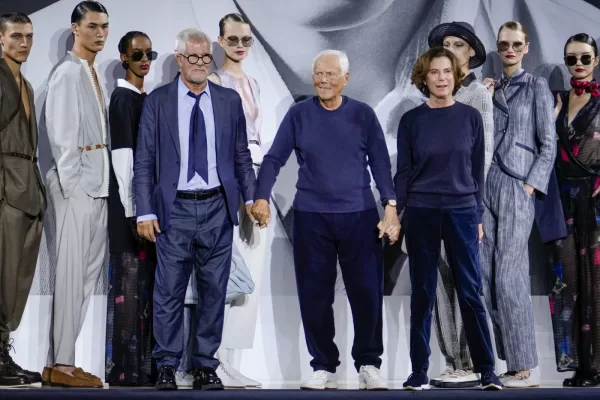 Italian fashion designer Giorgio Armani, center, with Pantaleo Dell\’Orco, head of Armani men\’s style office for all collections, left, and Roberta Armani, right, acknowledge the applause at the end of the Emporio Armani Spring Summer 2025 collection that was presented in Milan, Italy, Thursday, Sept. 19, 2024. (AP Photo/Luca Bruno) Associated Press / LaPresse Only italy and Spain