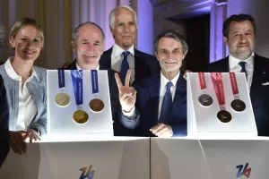 From left: Former Italian swimmer Federica Pellegrini, Veneto region President Luca Zaia, Milano Cortina 2026 Foundation President Giovanni Malago Lombardy region President Attilio Fontana and Italy’s vice Premier Matteo Salvini pose for photographers next to Milano Cortina 2026 Winter Olympics and Paralympics medals during the unveiling ceremony in Venice, Italy, Tuesday, July 15, 2025. (AP Photo/Luigi Costantini)

Associated Press/LaPresse
