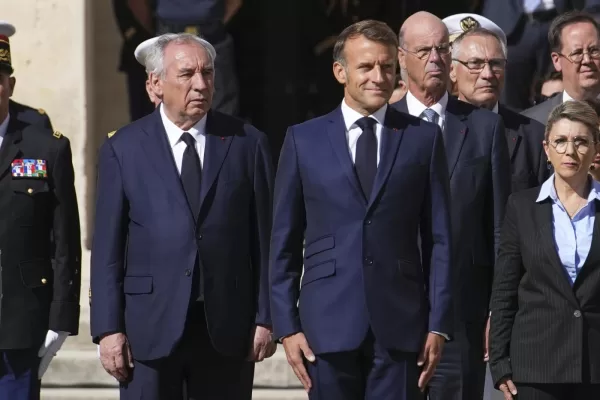 France’s President Emmanuel Macron, right, and France’s Prime Minister Francois Bayrou attend a farewell ceremony for outgoing Chief of Staff of the French Armed Forces Thierry Burkhard, in the courtyard of the Invalides , in Paris, France, Friday, Sept. 5, 2025. (AP Photo/Christophe Ena, Pool)
