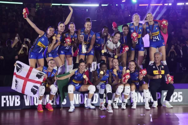 Italian players celebrate with their gold medal on podium after winning the FIVB Women’s Volleyball World Championship 2025 final match against Turkey at the Huamark Indoor Stadium, in Bangkok, Thailand, Sunday, Sept. 7, 2025. (AP Photo/Sakchai Lalit)