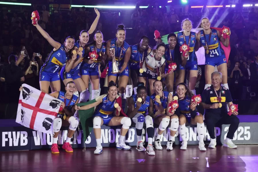 Italian players celebrate with their gold medal on podium after winning the FIVB Women’s Volleyball World Championship 2025 final match against Turkey at the Huamark Indoor Stadium, in Bangkok, Thailand, Sunday, Sept. 7, 2025. (AP Photo/Sakchai Lalit)