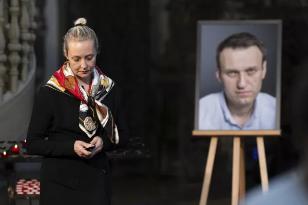 FILE -Yulia Navalnaya, widow of Russian opposition leader Alexei Navalny walks away from his picture after lighting a candle at the end of a service in St. Mary’s Church on the occasion of his birthday, in Berlin, June 4, 2024. (Christoph Gollnow/dpa/dpa via AP, File)