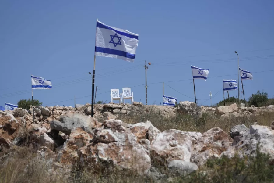 FILE – Israeli flags fly flutter on top of a hill that is adjacent to Palestinian properties that were under attack by Israeli settlers overnight, leaving several burnt vehicles and damaged homes, residents said, in the West Bank village of Bruqin, near Salfit, Friday, May 23, 2025. (AP Photo/Nasser Nasser, File) 


Associated Press / LaPresse
Only italy and spain