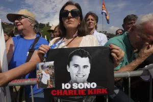 A woman holds a photo of Charlie Kirk that reads: “I am Charlie Kirk”, during the League party’s annual gathering in Pontida, north of Italy, Sunday, Sept. 21, 2025. (AP Photo/Antonio Calanni)
Associated Press/LaPresse A woman holds a photo of Charlie Kirk that reads: “I am Charlie Kirk”, during the League party’s annual gathering in Pontida, north of Italy, Sunday, Sept. 21, 2025. (AP Photo/Antonio Calanni)
Associated Press/LaPresse