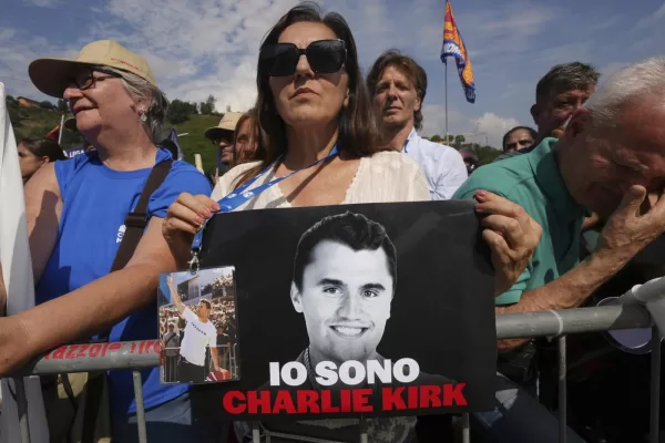 A woman holds a photo of Charlie Kirk that reads: “I am Charlie Kirk”, during the League party’s annual gathering in Pontida, north of Italy, Sunday, Sept. 21, 2025. (AP Photo/Antonio Calanni)

Associated Press/LaPresse
