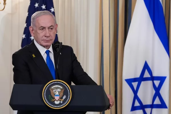 Israel’s Prime Minister Benjamin Netanyahu listens as President Donald Trump speaks during a news conference in the State Dining Room of the White House, Monday, Sept. 29, 2025, in Washington. (AP Photo/Alex Brandon)