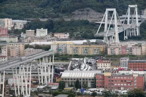 FILE – In this Tuesday, Aug. 14, 2018 file photo cars are blocked on the Morandi highway bridge after a section of it collapsed, in Genoa, northern Italy. Fifty-nine people went on trial Thursday, July 7, 2022, for the 2018 collapse of Genoa’s Morandi bridge, accused of manslaughter and other charges in the deaths of 43 people. (AP Photo/Antonio Calanni, File) FILE – In this Tuesday, Aug. 14, 2018 file photo cars are blocked on the Morandi highway bridge after a section of it collapsed, in Genoa, northern Italy. Fifty-nine people went on trial Thursday, July 7, 2022, for the 2018 collapse of Genoa’s Morandi bridge, accused of manslaughter and other charges in the deaths of 43 people. (AP Photo/Antonio Calanni, File)