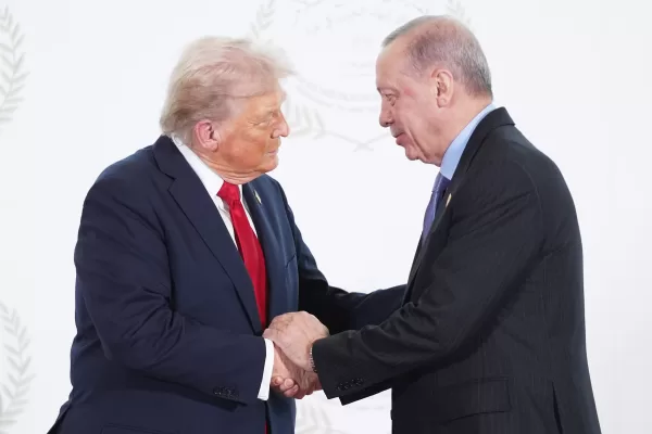 President Donald Trump greets Turkey’s President Recep Tayyip Erdogan during a summit to support ending the more than two-year Israel-Hamas war in Gaza after a breakthrough ceasefire deal, Monday, Oct. 13, 2025, in Sharm El Sheikh, Egypt. (AP Photo/Evan Vucci, Pool)