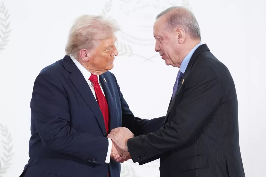 President Donald Trump greets Turkey’s President Recep Tayyip Erdogan during a summit to support ending the more than two-year Israel-Hamas war in Gaza after a breakthrough ceasefire deal, Monday, Oct. 13, 2025, in Sharm El Sheikh, Egypt. (AP Photo/Evan Vucci, Pool)