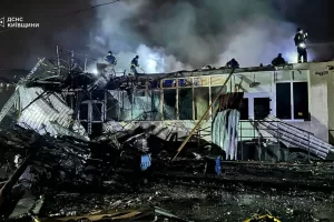 In this photo provided by the Ukrainian Emergency Service, emergency services personnel work to extinguish a fire following a Russian attack in Brovary, near Kyiv, Ukraine, Friday, Oct. 10, 2025. (Ukrainian Emergency Service via AP)