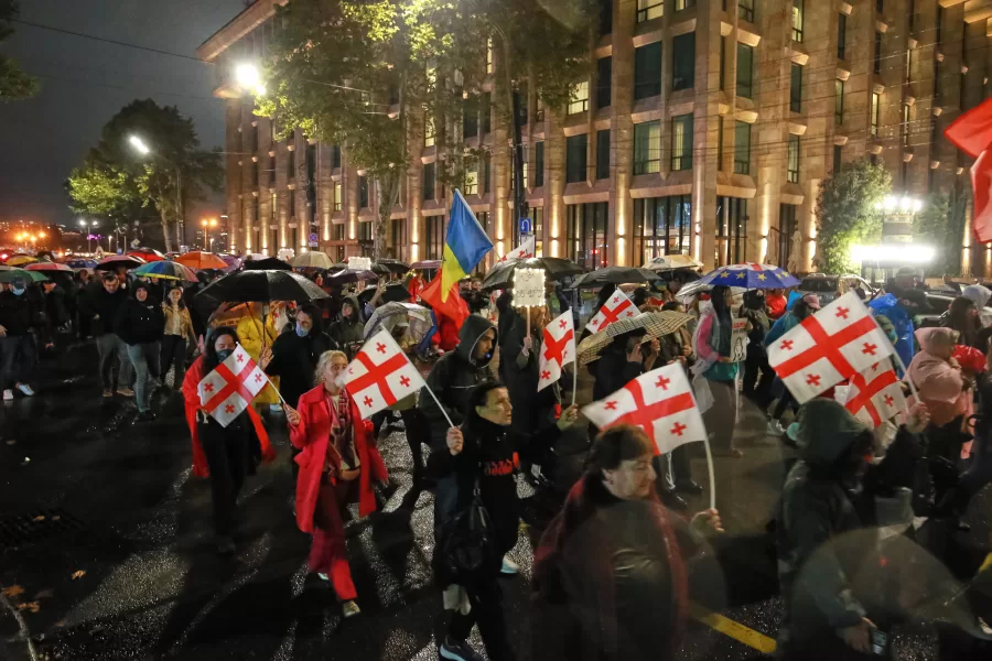 Protesters with Georgian national flags gather in the city center of Tbilisi, Georgia, Wednesday, Oct. 1, 2025 to denounce Georgian government’s anti European stance and call for the release of prisoners detained as part of a crackdown on political opponents ahed of the municipal elections. (AP Photo/Zurab Tsertsvadze)
