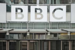 FILE – This photo shows a BBC sign outside the entrance to the headquarters of the publicly funded media organization in London, July 19, 2017. (AP Photo/Frank Augstein, File)