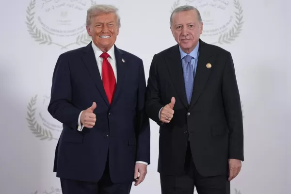 President Donald Trump greets Turkey’s President Recep Tayyip Erdogan during a summit to support ending the more than two-year Israel-Hamas war in Gaza after a breakthrough ceasefire deal, Monday, Oct. 13, 2025, in Sharm El Sheikh, Egypt. (AP Photo/Evan Vucci, Pool)