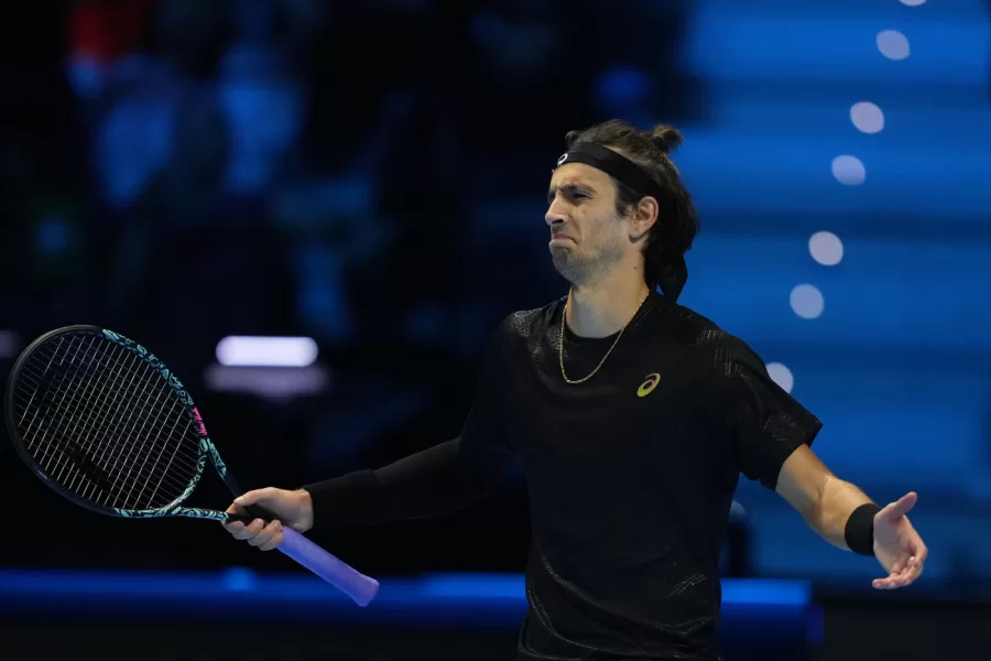 Italy’s Lorenzo Musetti celebrates after winning against Australia’s Alex de Minaur during their tennis match of the ATP World Tour Finals, in Turin, Italy, Tuesday, Nov. 11, 2025. (AP Photo/Antonio Calanni)