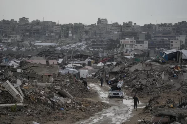 A car drives along a muddy road amid destroyed buildings in the Sheikh Radwan neighborhood of Gaza City, Friday, Nov. 14, 2025. (AP Photo/Jehad Alshrafi) A car drives along a muddy road amid destroyed buildings in the Sheikh Radwan neighborhood of Gaza City, Friday, Nov. 14, 2025. (AP Photo/Jehad Alshrafi)