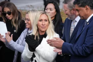 Rep. Marjorie Taylor-Greene, R-Ga., center, with Rep. Thomas Massie, R-Ky., second from right, and Rep. Ro Khanna, D-Calif., far right, applauds during a news conference as the House prepares to vote on the Epstein Files Transparency Act, at the Capitol in Washington, Tuesday, Nov. 18, 2025. (AP Photo/J. Scott Applewhite) Rep. Marjorie Taylor-Greene, R-Ga., center, with Rep. Thomas Massie, R-Ky., second from right, and Rep. Ro Khanna, D-Calif., far right, applauds during a news conference as the House prepares to vote on the Epstein Files Transparency Act, at the Capitol in Washington, Tuesday, Nov. 18, 2025. (AP Photo/J. Scott Applewhite)