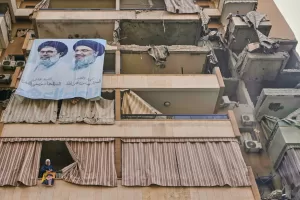 A woman hangs a banner depicting Hezbollah’s late leader Hassan Nasrallah on her balcony below larger posters of Nasrallah and his cousin and successor, Hashem Safieddine, on a residential building damaged in Sunday’s Israeli airstrike that killed Hezbollah’s chief of staff, Haytham Tabtabai, in the southern suburb of Hareit Hreik, Lebanon, Monday, Nov. 24, 2025. (AP Photo/Hassan Ammar)





Associate Press/ LaPresse
Only Italy and Spain
