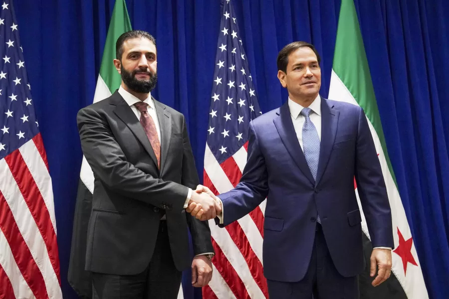 Secretary of State Marco Rubio shakes hands with Syrian interim President Ahmad al-Sharaa at the Lotte New York Palace Hotel, on the sidelines of the 80th United Nations General Assembly at the United Nations headquarters, Monday, Sept. 22, 2025. (Bing Guan/Pool Photo via AP)