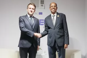 CORRECTS ID TO CHAIRPERSON OF THE AFRICAN UNION COMMISSION MAHAMOUD ALI YOUSSOUF – France’s President Emmanuel Macron, left, meets chairperson of the African Union Commission Mahamoud Ali Youssouf on the sideline of the African Union-European Union summit in Luanda, Angola, Monday, Nov. 24, 2025. (AP Photo/Thibault Camus)