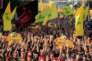 Hezbollah fighters and supporters raise their fists and chant slogans as they march in the funeral procession of five comrades killed in Israeli strikes in recent days, in the southern town of Nabatieh, Lebanon, Sunday, Nov. 2, 2025. (AP Photo/Mohammad Zaatari) Hezbollah fighters and supporters raise their fists and chant slogans as they march in the funeral procession of five comrades killed in Israeli strikes in recent days, in the southern town of Nabatieh, Lebanon, Sunday, Nov. 2, 2025. (AP Photo/Mohammad Zaatari)