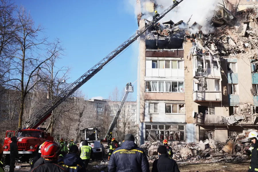 Rescue workers put out a fire of a residential building which was heavily damaged by a Russian strike on Ternopil, Ukraine, on Wednesday, Nov. 19, 2025. (AP Photo/Rostyslav Kovalchuk)