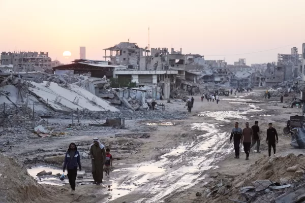 Palestinians walk among destroyed buildings in Khan Younis, southern Gaza Strip, Sunday, Nov. 2, 2025. (AP Photo/Jehad Alshrafi) Palestinians walk among destroyed buildings in Khan Younis, southern Gaza Strip, Sunday, Nov. 2, 2025. (AP Photo/Jehad Alshrafi)
