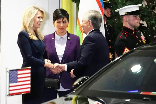 Monica Crowley, White House chief of protocol, left, greets Uzbekistan’s President Shavkat Mirziyoyev and leaders from Central Asia, Thursday, Nov. 6, 2025, at the West Wing of the White House in Washington. (AP Photo/Jacquelyn Martin)
