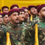 Hezbollah fighters chant during the funeral procession of the group’s chief of staff, Haytham Tabtabai, and two other Hezbollah members killed in Sunday’s Israeli airstrike, in a southern suburb of Beirut, Lebanon, Monday, Nov. 24, 2025. (AP Photo/Hussein Malla)