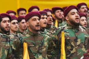 Hezbollah fighters chant during the funeral procession of the group’s chief of staff, Haytham Tabtabai, and two other Hezbollah members killed in Sunday’s Israeli airstrike, in a southern suburb of Beirut, Lebanon, Monday, Nov. 24, 2025. (AP Photo/Hussein Malla)