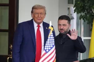 President Donald Trump, left, greets Ukraine’s President Volodymyr Zelenskyy as he arrives at the White House, Monday, Aug. 18, 2025, in Washington. (AP Photo/Alex Brandon)