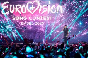FILE – JJ, from Austria, stands on the stage with his trophy after winning the Grand Final of the 69th Eurovision Song Contest in Basel, Switzerland, May 18, 2025. (AP Photo/Martin Meissner, File)