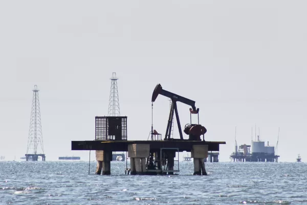 An oil pump jack stands unused in Cabimas, Venezuela, Wednesday, Jan. 7, 2026. (AP Photo/Edgar Frias)