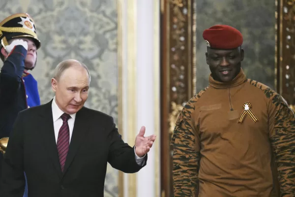 Russian President Vladimir Putin, left, welcomes Burkina Faso President Ibrahim Traore in the Grand Palace at the Kremlin in Moscow, Russia, on Saturday, May 10, 2025, as part of celebrations of the 80th anniversary of the Soviet Union’s victory over Nazi Germany during the World War II. (Angelos Tzortzinis/Pool Photo via AP)
