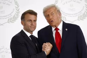 French President Emmanuel Macron and President Donald Trump shake hands during the family picture at the Gaza International Peace Summit, in Sharm el-Sheikh, Egypt, Monday, Oct.13 2025. (Yoan Valat, Pool photo via AP) French President Emmanuel Macron and President Donald Trump shake hands during the family picture at the Gaza International Peace Summit, in Sharm el-Sheikh, Egypt, Monday, Oct.13 2025. (Yoan Valat, Pool photo via AP)