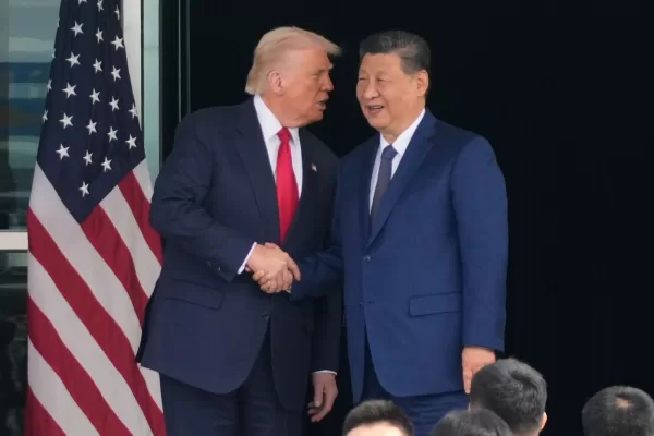 President Donald Trump, left, and Chinese President Xi Jinping, shake hands after their meeting at Gimhae International Airport Jinping in Busan, South Korea, Thursday, Oct. 30, 2025. (AP Photo/Mark Schiefelbein)