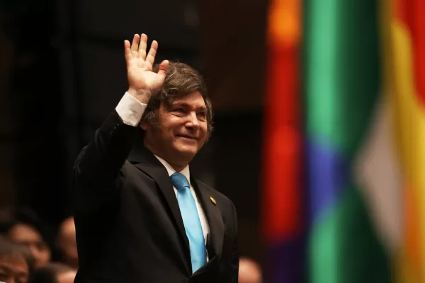 Argentina’s President Javier Milei waves as he attends the swearing-in ceremony of President Rodrigo Paz in La Paz, Bolivia, Saturday, Nov. 8, 2025. (Luis Gandarillas, Pool Photo via AP)