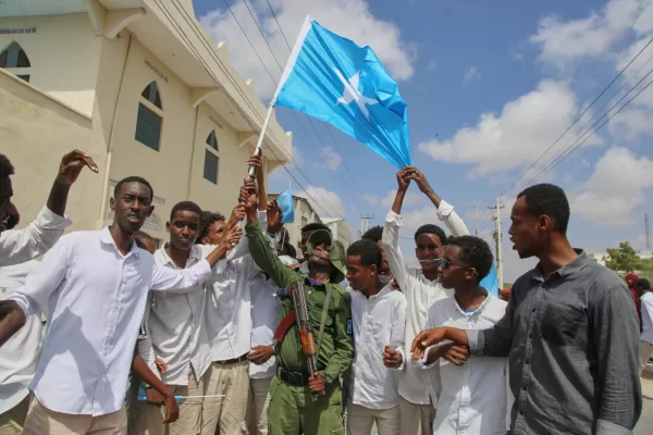 People raise Somalia’s flag as they protest Israel’s recognition of Somalia’s breakaway region of Somaliland as an independent nation, in Mogadishu, Somalia, Tuesday, Dec. 30, 2025. (AP photo/Farah Abdi Warsameh)