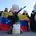 A man wearing a mask of U.S. President Donald Trump holds a mock gun during a rally denouncing the U.S. government and Trump after the U.S. captured Venezuelan President Nicolás Maduro, near the U.S. Embassy in Seoul, South Korea, Monday, Jan. 5, 2026. (AP Photo/Lee Jin-man)





Associate Press/ LaPresse
Only Italy and Spain